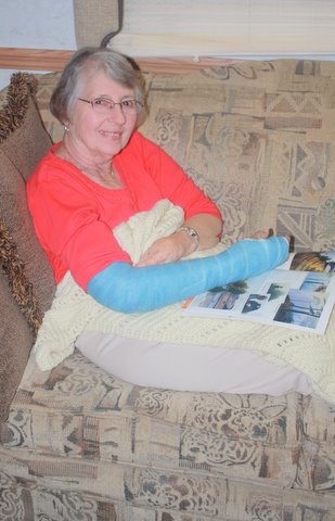 Photo of Pat in blue long-arm cast.